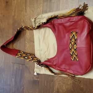 Genuine leather red unique handbag.